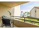 Balcony boasts a view of the tropical foliage, community pool and ocean beyond at 103 1St E St # 115, Tierra Verde, FL 33715