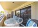 Relaxing balcony with sliding glass doors provides easy access to the living space at 103 1St E St # 115, Tierra Verde, FL 33715