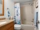 Bathroom featuring a shower/tub and a wood vanity with granite countertops at 103 1St E St # 115, Tierra Verde, FL 33715