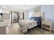 Stylishly decorated bedroom featuring balcony access and coastal-themed decor at 103 1St E St # 115, Tierra Verde, FL 33715