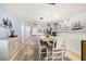Charming dining room adjacent to the kitchen, perfect for Gathering meals at 103 1St E St # 115, Tierra Verde, FL 33715