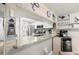 Bright kitchen featuring granite countertops and stainless steel appliances at 103 1St E St # 115, Tierra Verde, FL 33715