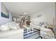 Spacious living room featuring an open layout and stylish furniture at 103 1St E St # 115, Tierra Verde, FL 33715