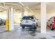 Covered parking garage area with cars parked under yellow support beams at 103 1St E St # 115, Tierra Verde, FL 33715
