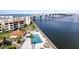 Waterfront condo complex featuring community pool, tiki hut, and gorgeous views of the bay and bridge at 103 1St E St # 115, Tierra Verde, FL 33715