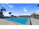 Large outdoor swimming pool featuring lounge chairs and a gazebo overlooking the marina at 103 1St E St # 115, Tierra Verde, FL 33715