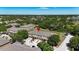 An aerial image shows a red pin marking a home within a townhome community and lush landscaping at 10418 Tulip Field Way, Riverview, FL 33578