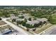 A beautiful aerial view captures a townhome community with verdant trees and meticulous landscaping at 10418 Tulip Field Way, Riverview, FL 33578