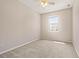 Bedroom with neutral carpet, ceiling fan and a window for natural light, ample space for furniture at 10418 Tulip Field Way, Riverview, FL 33578