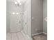 Light and bright entryway features neutral paint, tile floors, and a decorative chandelier at 10418 Tulip Field Way, Riverview, FL 33578