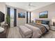 Serene main bedroom with a ceiling fan, plush carpet, and stylish decor at 10418 Tulip Field Way, Riverview, FL 33578