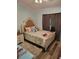 Bedroom featuring a plush bed, wood floors, and neutral walls with LED accent lighting at 1061 6Th Nw St, Largo, FL 33770
