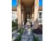 Inviting front entrance with stone walkway, stylish columns, arched window, and decorative flower pots at 1061 6Th Nw St, Largo, FL 33770