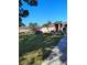 Home featuring a well-kept lawn and minimalist landscaping with a sidewalk leading to the entrance at 1061 6Th Nw St, Largo, FL 33770