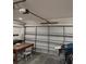 Garage featuring a table and chairs, as well as the automatic door opener at 1061 6Th Nw St, Largo, FL 33770