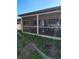 Enclosed patio with sliding windows, overlooking the backyard at 1061 6Th Nw St, Largo, FL 33770