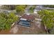 Aerial view of a home with a screened-in pool and a shed in the backyard at 11347 Amboy St, Spring Hill, FL 34609