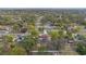 Aerial view showcasing a neighborhood with tree-lined streets and well-maintained homes at 11347 Amboy St, Spring Hill, FL 34609