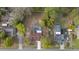 Aerial view of neighborhood homes, including one with a screened-in pool at 11347 Amboy St, Spring Hill, FL 34609