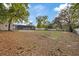 Large backyard featuring a screened-in patio at 11347 Amboy St, Spring Hill, FL 34609