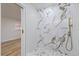 Bathroom featuring a glass shower with a tiled surround and modern fixtures at 11347 Amboy St, Spring Hill, FL 34609