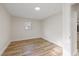 Bedroom featuring wood-look floors and a large window at 11347 Amboy St, Spring Hill, FL 34609