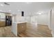 Bright, open-concept kitchen with wood cabinets, quartz countertops, and stainless steel appliances at 11347 Amboy St, Spring Hill, FL 34609