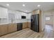 Modern kitchen with stainless steel appliances, stylish two-tone cabinetry, and a bright and airy feel at 11347 Amboy St, Spring Hill, FL 34609