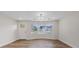 Entryway features a chandelier, hardwood floors, and large windows providing plenty of natural light at 11347 Amboy St, Spring Hill, FL 34609