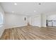 Spacious living room with wood flooring, closet space and access to laundry area at 11347 Amboy St, Spring Hill, FL 34609