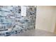 Artistic backsplash featuring captivating blue and white marbled tiles, enhancing the kitchen's aesthetic appeal at 11598 Oak Ln, Largo, FL 33778