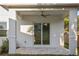 Covered patio features tile flooring, a ceiling fan, and sliding glass doors at 11598 Oak Ln, Largo, FL 33778
