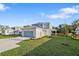 Beautiful two-story home featuring a well-kept lawn, paved driveway, and attached two car garage at 11598 Oak Ln, Largo, FL 33778