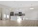 Modern kitchen with white cabinets, stainless appliances, and a center island at 11598 Oak Ln, Largo, FL 33778