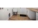 Laundry room featuring a utility sink, wooden countertops, and wood-look flooring at 11598 Oak Ln, Largo, FL 33778