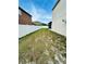 A view of the backyard space surrounded by a white vinyl fence for privacy at 12814 Longcrest Dr, Riverview, FL 33579