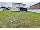 Expansive backyard with a white vinyl fence and a screened patio at 12814 Longcrest Dr, Riverview, FL 33579