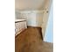 Upstairs hallway with wood railing and multiple rooms at 12814 Longcrest Dr, Riverview, FL 33579