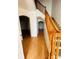 Hallway featuring beautiful hardwood flooring and a classic wooden staircase at 12814 Longcrest Dr, Riverview, FL 33579