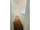 Hallway with carpet, doors, and view to living room at 12814 Longcrest Dr, Riverview, FL 33579