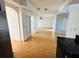Open-concept living room with wood flooring and a view into multiple spaces at 12814 Longcrest Dr, Riverview, FL 33579
