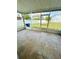 A screened-in patio with tiled flooring, offering a relaxing outdoor space at 12814 Longcrest Dr, Riverview, FL 33579