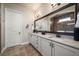 Well-lit bathroom with granite countertops, double sinks, and decorative lighting at 13917 Kingfisher Glen Dr, Lithia, FL 33547