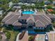 Aerial view of community clubhouse with pool, palm trees, basketball court and parking at 13917 Kingfisher Glen Dr, Lithia, FL 33547