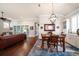 Dining room with hardwood floors, a chandelier, and access to the living area with natural light at 13917 Kingfisher Glen Dr, Lithia, FL 33547