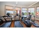 Gym featuring windows overlooking the pool area and treadmills and ellipticals at 13917 Kingfisher Glen Dr, Lithia, FL 33547