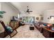 Bright living room features hardwood floors, a ceiling fan, and a comfortable seating area with natural light at 13917 Kingfisher Glen Dr, Lithia, FL 33547