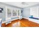 Bright bedroom with three windows, hardwood floors, and a built-in bench by the window at 145 19Th Se Ave, St Petersburg, FL 33705