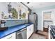 Stylish kitchen featuring modern appliances and bright blue countertops at 145 19Th Se Ave, St Petersburg, FL 33705