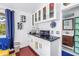 Well-lit kitchenette boasts stylish cabinets, sleek countertops, wine rack and stainless steel appliances at 145 19Th Se Ave, St Petersburg, FL 33705